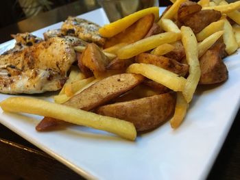 Close-up of french fries on plate