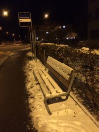 Illuminated snow covered landscape at night