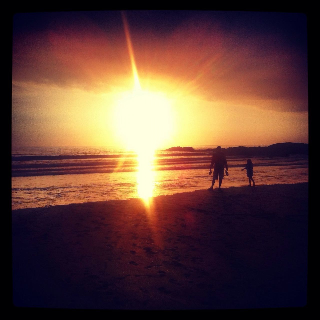 sunset, beach, sea, horizon over water, sun, water, silhouette, shore, scenics, sky, transfer print, beauty in nature, tranquil scene, sand, leisure activity, tranquility, lifestyles, sunlight, auto post production filter