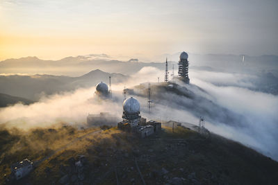 Built structure on mountain against sky