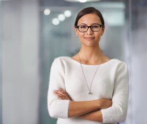 Portrait of woman standing in office