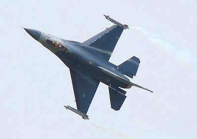 Low angle view of airplane flying in sky