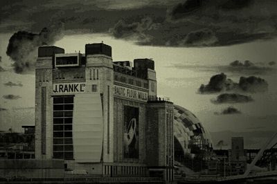 View of buildings against cloudy sky