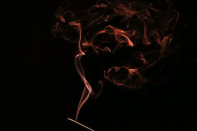 Close-up of fire against black background