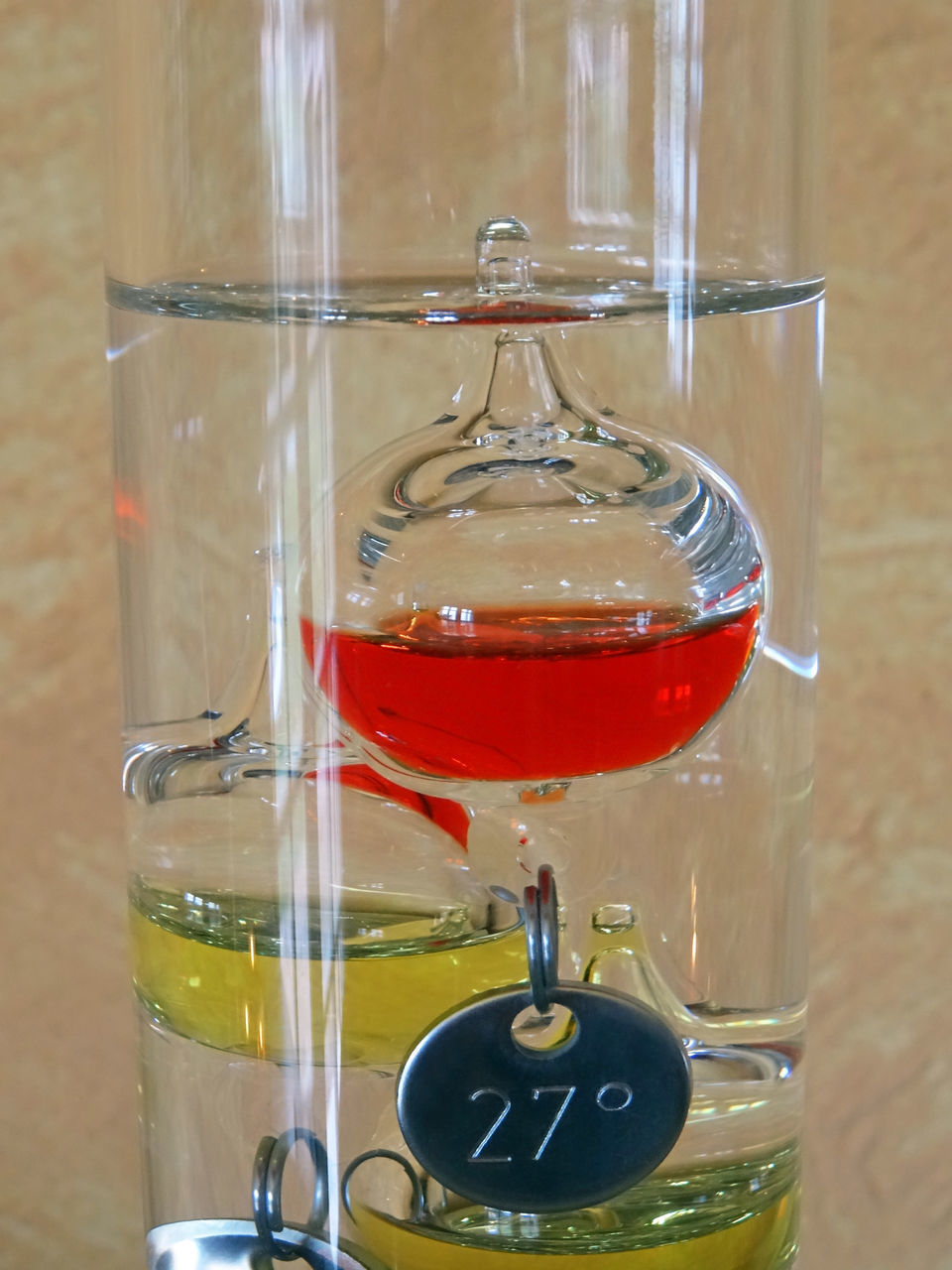 CLOSE-UP OF GLASS OF WINE ON TABLE