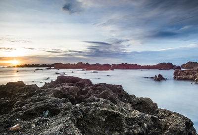 Scenic view of sea against sky during sunset