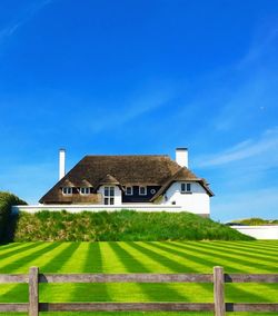 House on field against sky