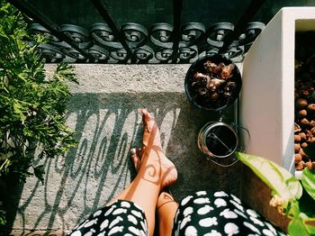 Low section of woman relaxing on floor