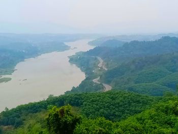 Scenic view of tree mountains against sky