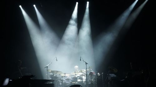 Spotlights on drums at concert