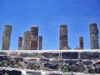 Low angle view of old building against blue sky