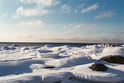 Scenic view of sea against sky during winter
