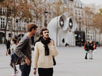 Young couple walking in city