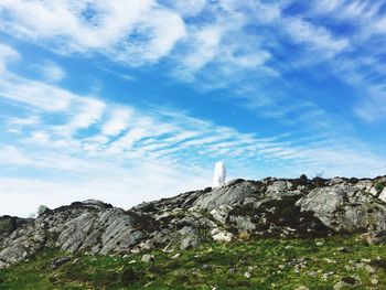 Low angle view of rock formations against sky