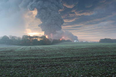 Scenic view of landscape against cloudy sky