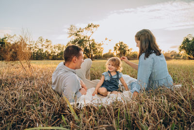 Young couple with cute two-years-old girl