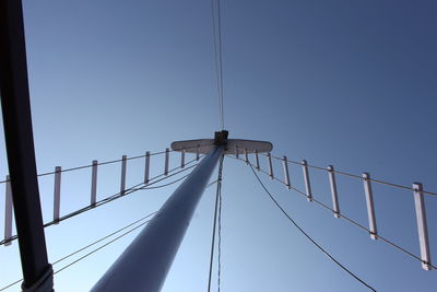 Low angle view of bridge against clear blue sky