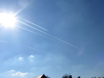 Low angle view of vapor trails in sky