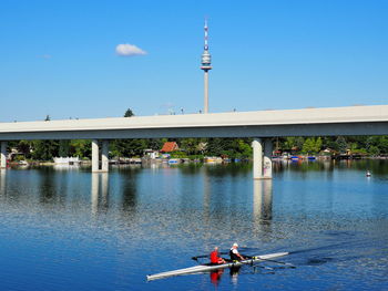 Bridge over river against blue sky