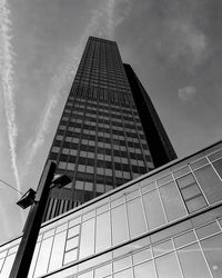 Low angle view of building against cloudy sky