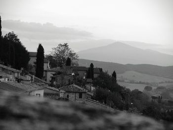 High angle view of buildings and mountains against sky