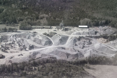 Aerial view of land and trees on field