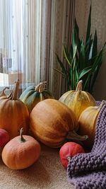 Close-up of pumpkins on table at home