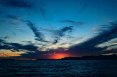 Scenic view of sea against romantic sky at sunset