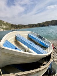 Boats moored in lake