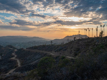 Scenic view of landscape against sky during sunset