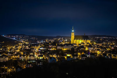 High angle view of city lit up at night on christmastime