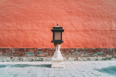 Street light on wall of building