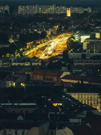 High angle view of illuminated buildings in city at night