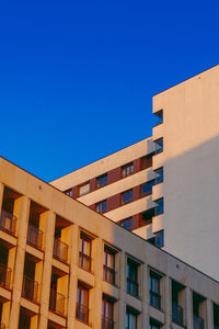 Low angle view of building against clear blue sky