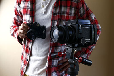 Man photographing camera