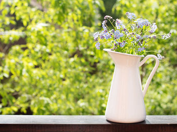 Close-up of white flower vase on table