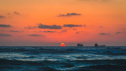 Scenic view of sea at sunset