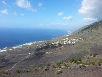 Scenic view of sea against cloudy sky