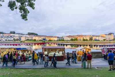 People at town square against sky