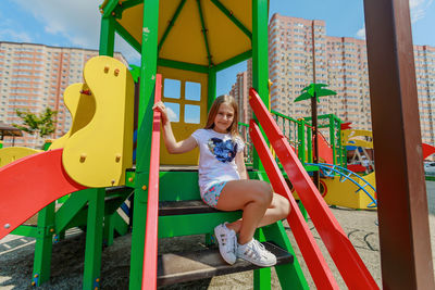 Happy girl playing on playground