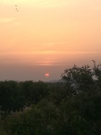 Scenic view of silhouette landscape against sky at sunset