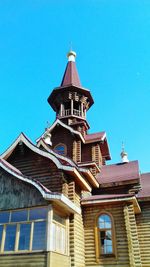 Low angle view of building against clear blue sky