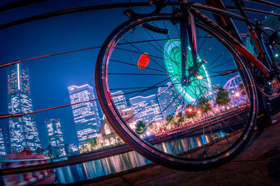 Ferris wheel in city against sky