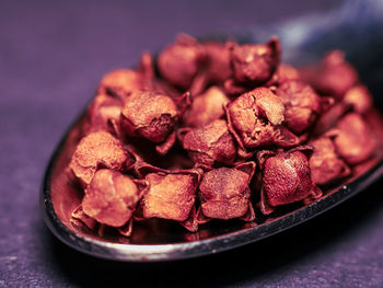 Close-up of chopped fruits in plate on table