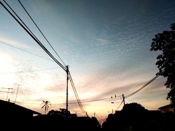 Low angle view of silhouette trees against sky during sunset