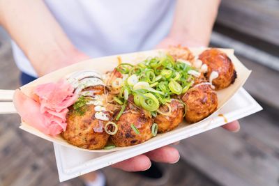 Close-up of man holding food