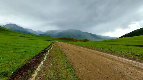 Foggy road in mountain valley on the northern coast of issyk-kul lake, kyrgyzstan