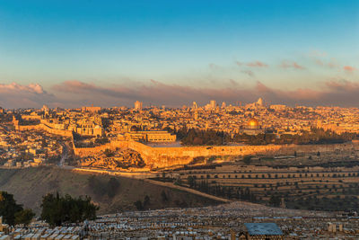 Aerial view of townscape against sky during sunset