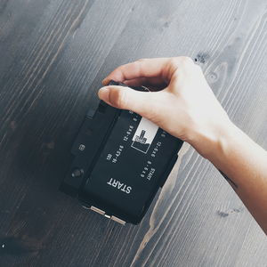 Close-up of hand holding camera