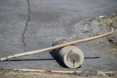 High angle view of abandoned container on beach